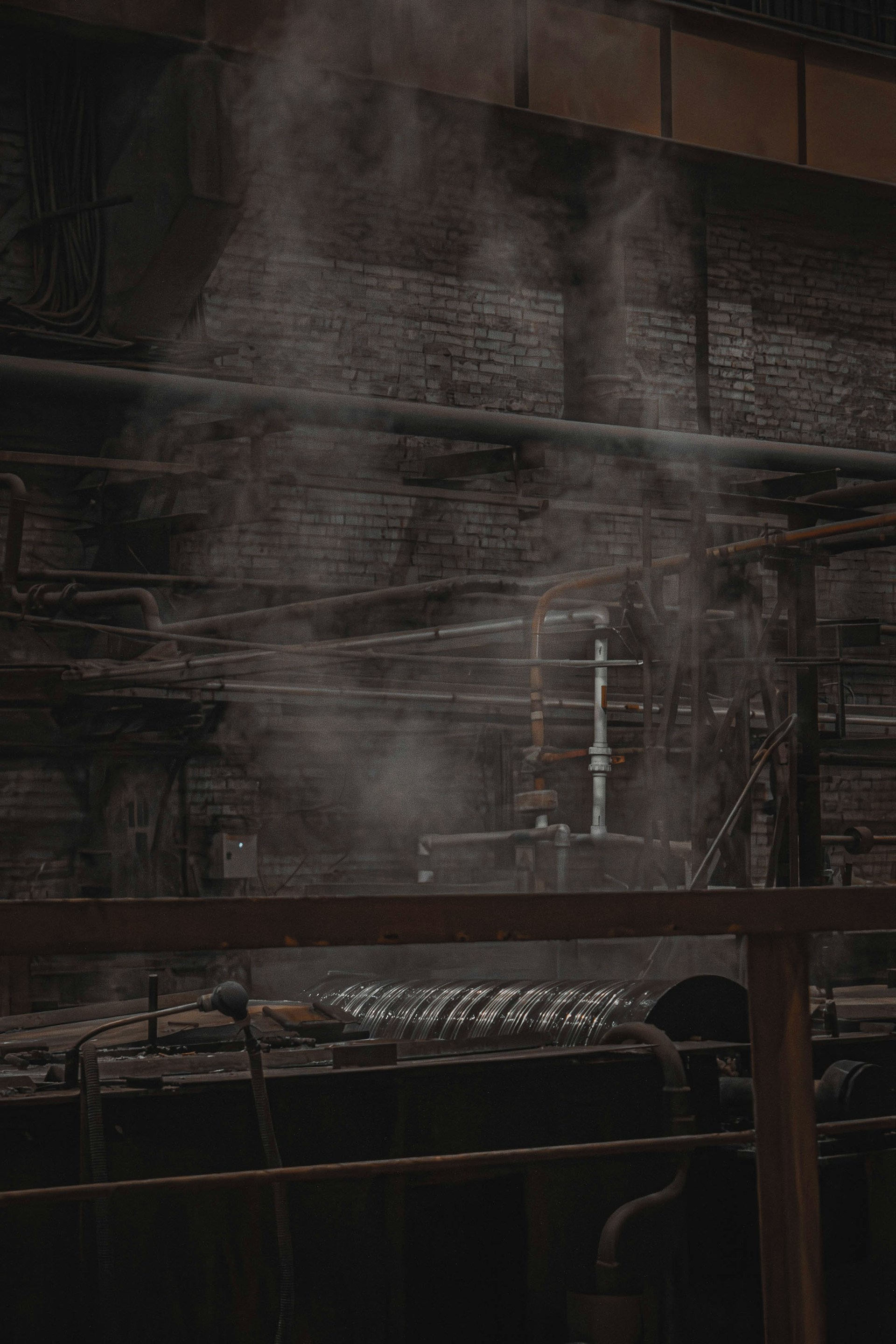 Steam rising from industrial factory piping — evaporation and mass transfer context. Photo: Shavr IK on Unsplash.